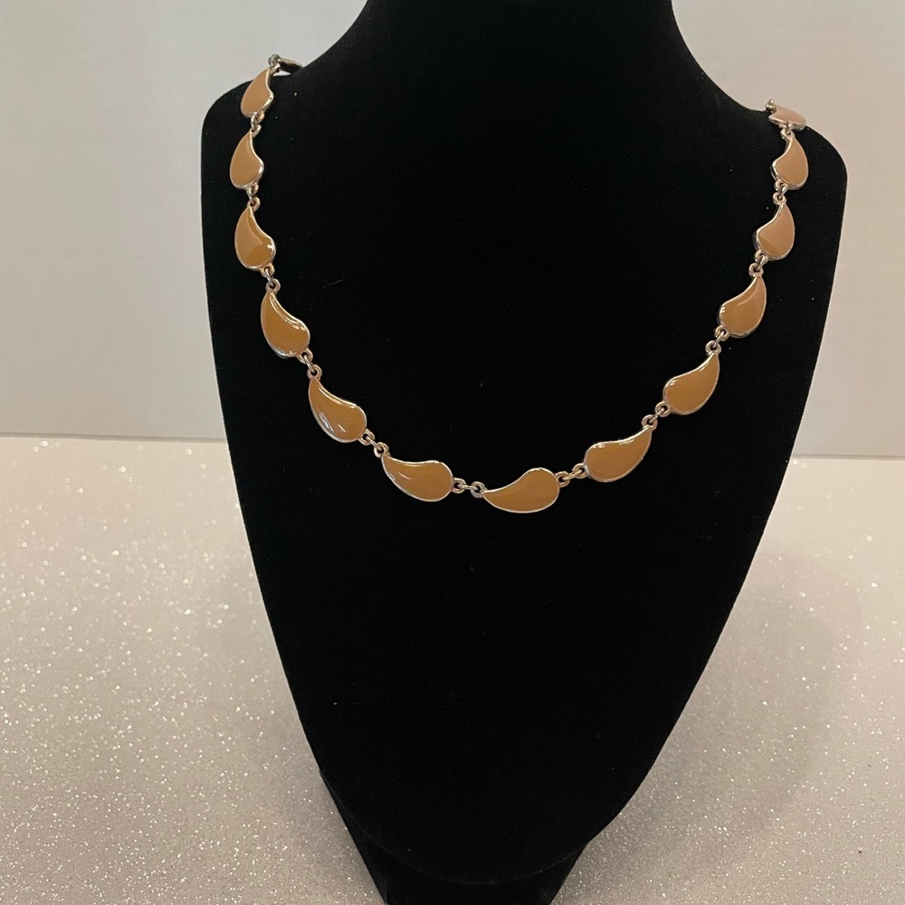 A series of beige tone delicately designed pieces.